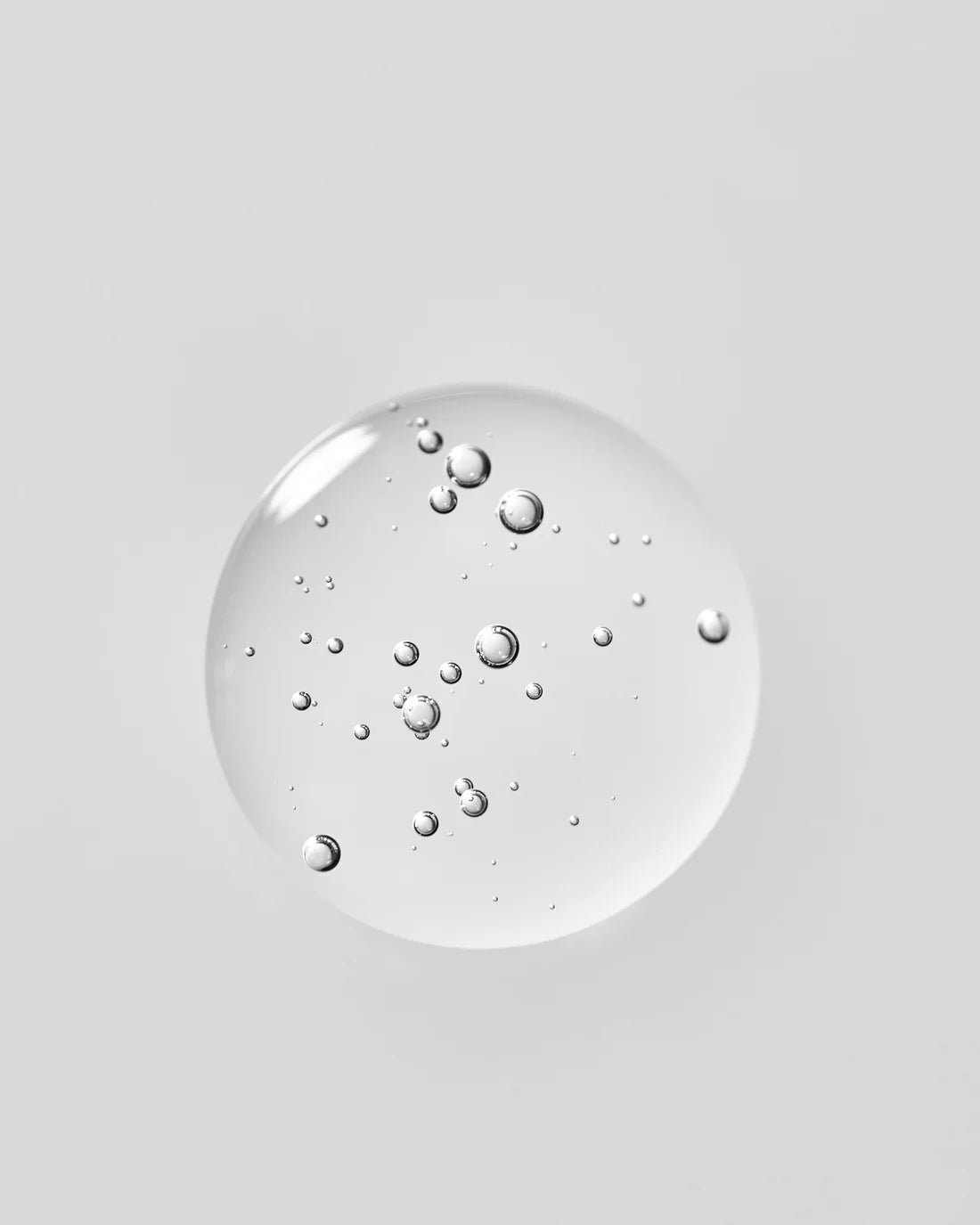 ADAPTOGENIC CLEANSER Gentle Longevity Face Wash bubbles in a clear gel, showcasing its soothing properties.