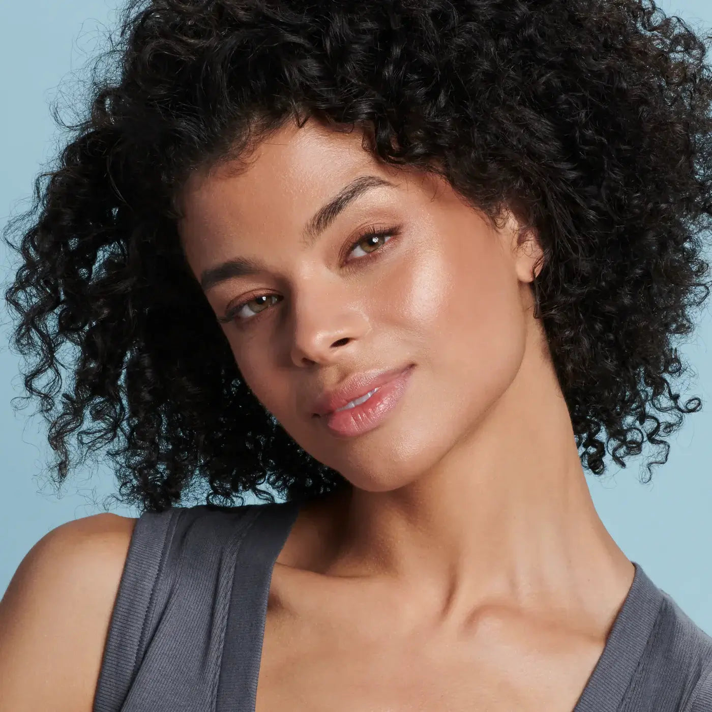 Colorescience Sunforgettable Total Protection Brush-On Shield Bronze SPF 50 showcased on a model with radiant skin.
