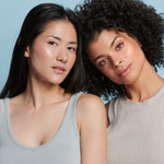 Two women showcasing radiant skin, promoting Colorescience Sunforgettable Total Protection Brush-On Shield Glow SPF 50.