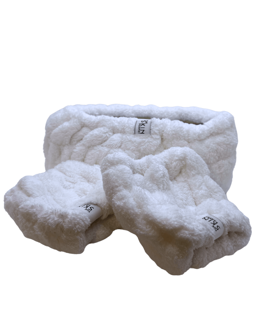 Plush headband and wrist cuff skincare set for hair management, includes wash headband and soft wrist cuffs.