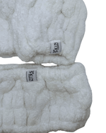 Plush headband and wrist cuff skincare set made of soft fabric, ideal for keeping hair dry and enhancing your skincare routine with a wash headband.