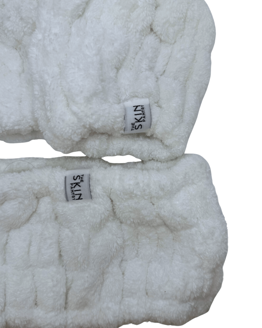 Plush headband and wrist cuff skincare set made of soft fabric, ideal for keeping hair dry and enhancing your skincare routine with a wash headband.
