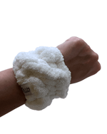 Plush wrist cuff from a skincare set to keep water away during skincare routines, features the wash headband focus keyword.