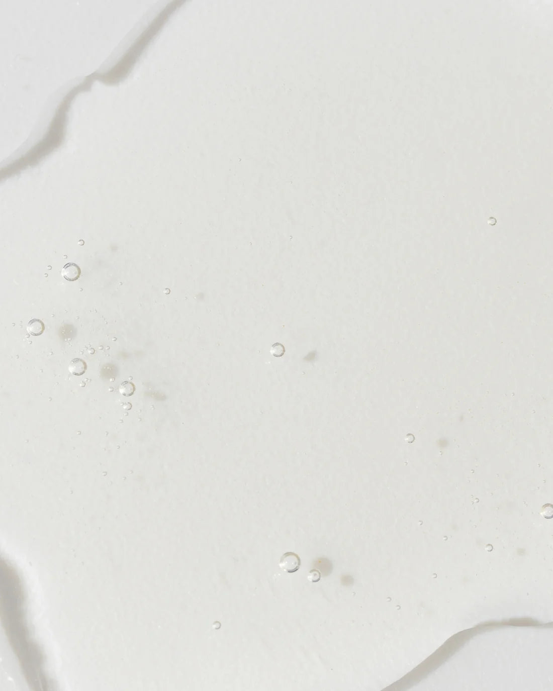 Vivier GrenzCine Serum texture showing clear gel with bubbles for firming and anti-aging benefits.