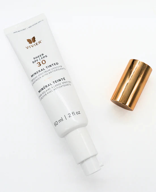 Vivier Sheer SPF 30 Mineral Tinted tube labelled mineral sunscreen with sheer tint for even skin tone travel friendly