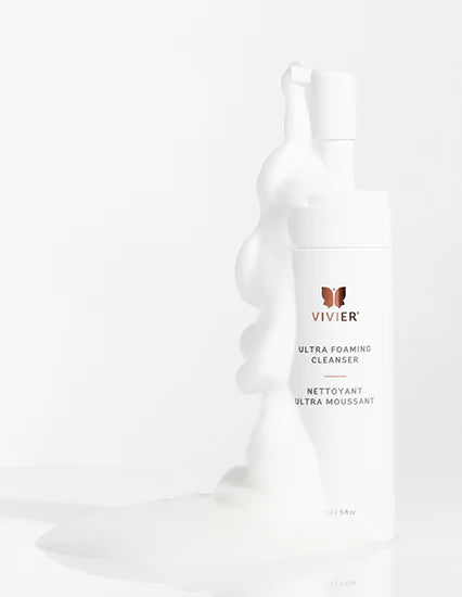 Vivier Ultra Foaming Cleanser bottle with foaming product spilling out on a clean backdrop.