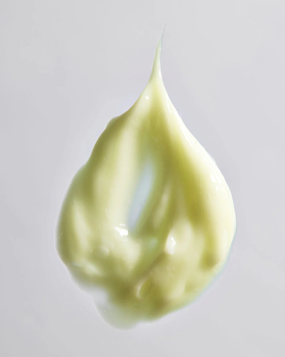YOUTH DAILY Skin Longevity Moisturizer creamy texture droplet on a light background.