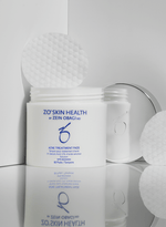 ZO Acne Treatment Pads in a jar with cotton pads for clear skin, featuring 2% salicylic acid for effective acne treatment.