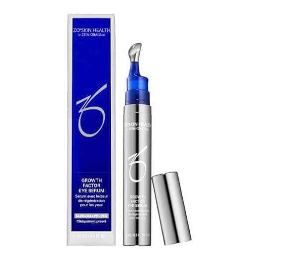 ZO Growth Factor Eye Serum in a sleek silver tube with a blue applicator for revitalizing tired eyes.